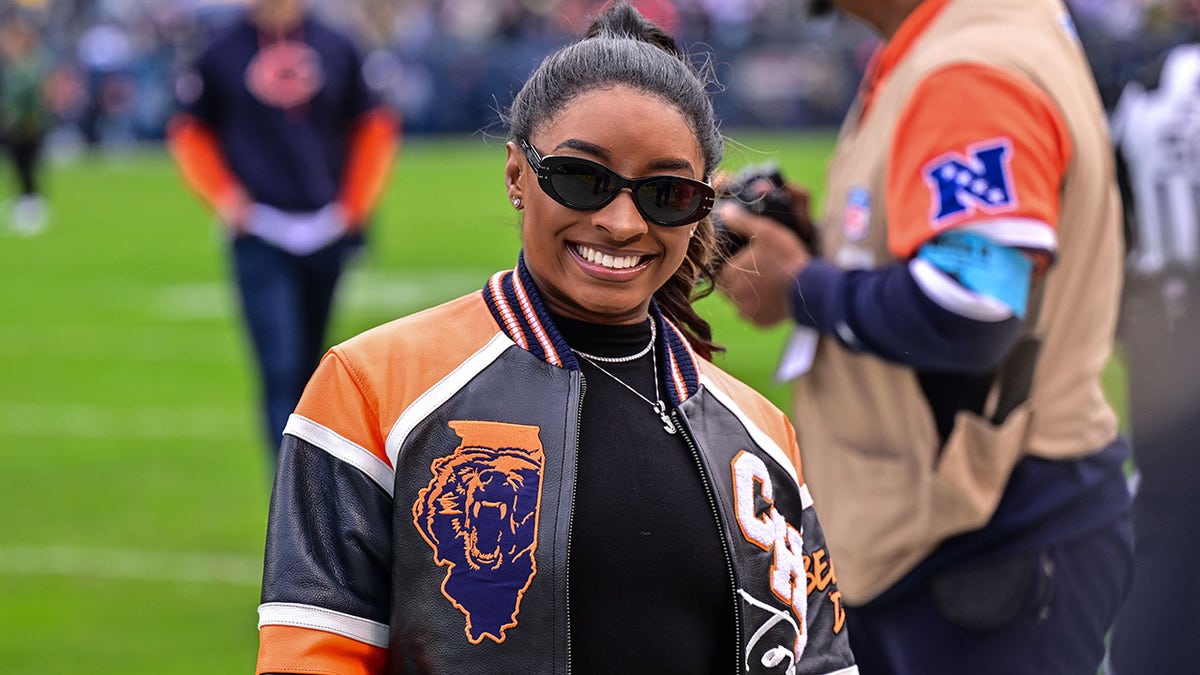 Simone Biles takes in a Bears-Packers game