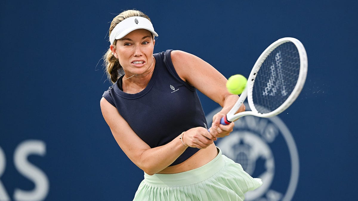 Danielle Collins returns a ball against Viktoriya Tomova