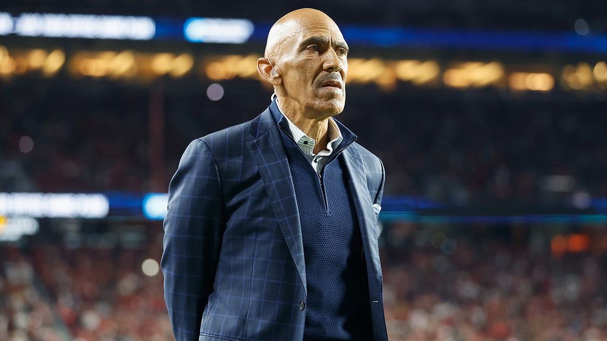 Tony Dungy looks on from the sideline