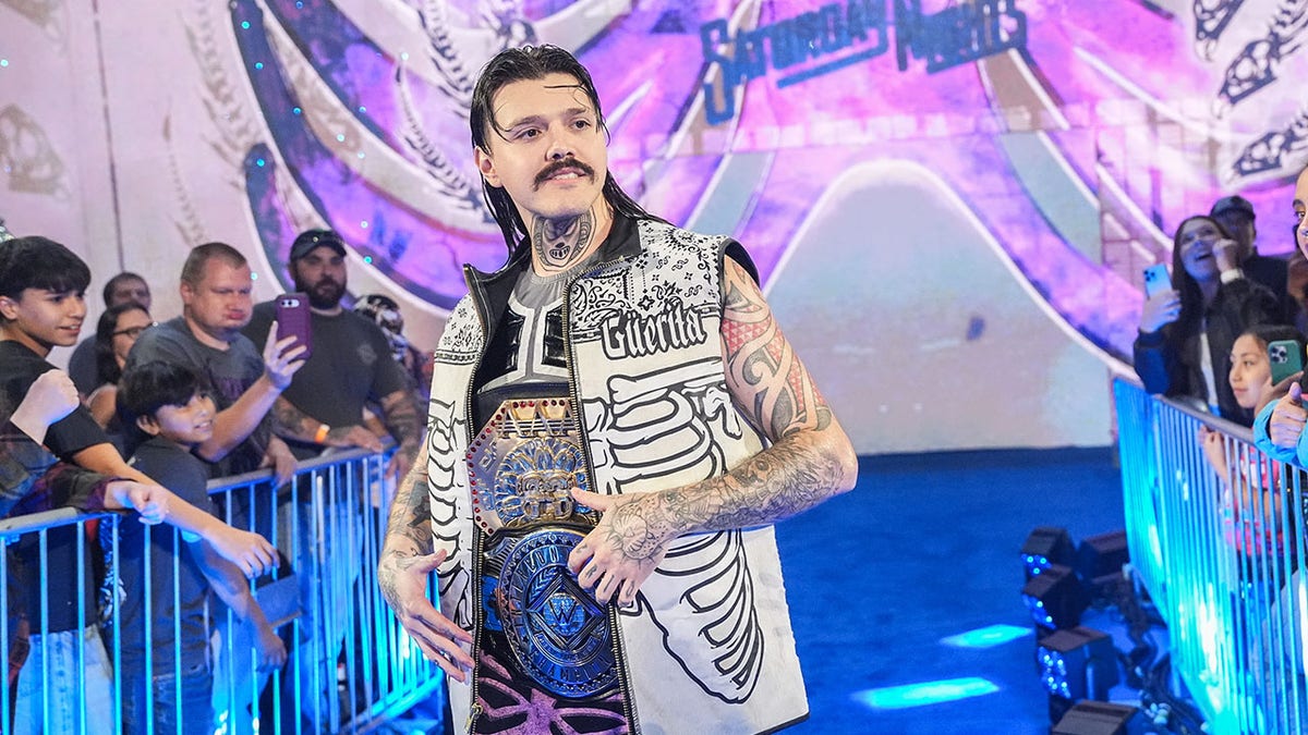 Dominik Mysterio with the Intercontinental Championship