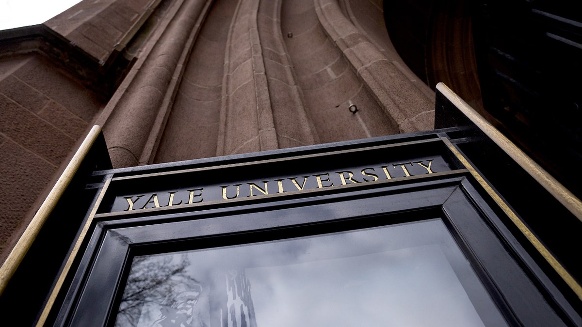 A doorway at yale University, where a student fraudster posing as "Katherina Lynn" was expelled after concocting a fake origin story and academic credentials.