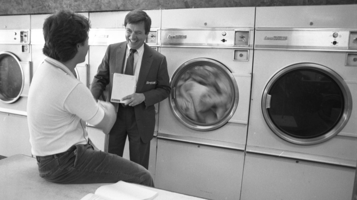 Dick Harpootlian featured in a black-and-white photograph in a laudromat