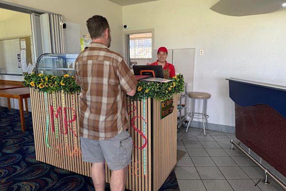 Loc Nguyen serving Brendan Field on Monday afternoon.