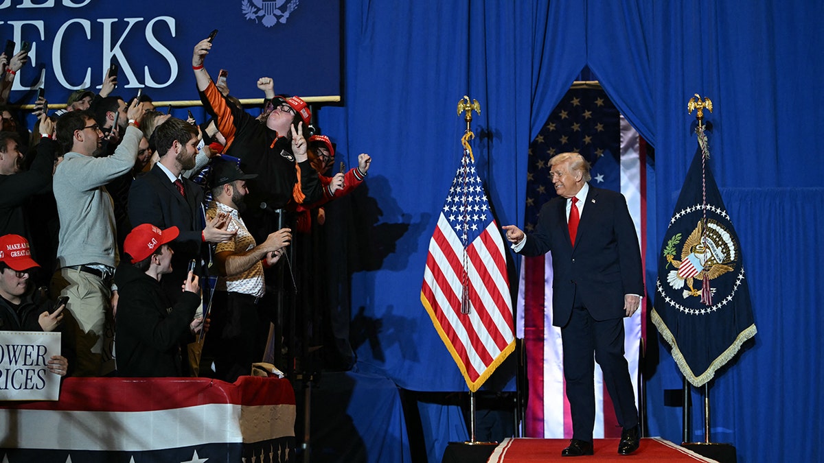 President Trump points, smiles at crowd