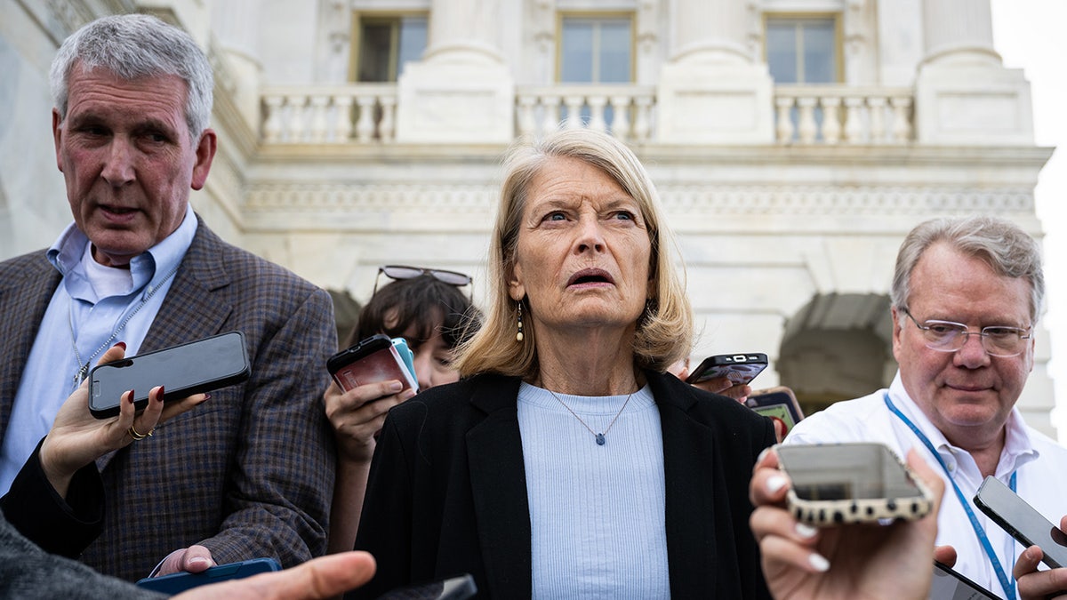 Sen. Lisa Murkowski speaks to reporters outside of the Capitol Building
