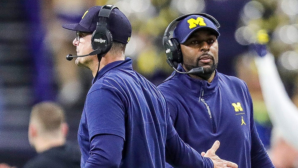 Sherrone Moore with Jim Harbaugh