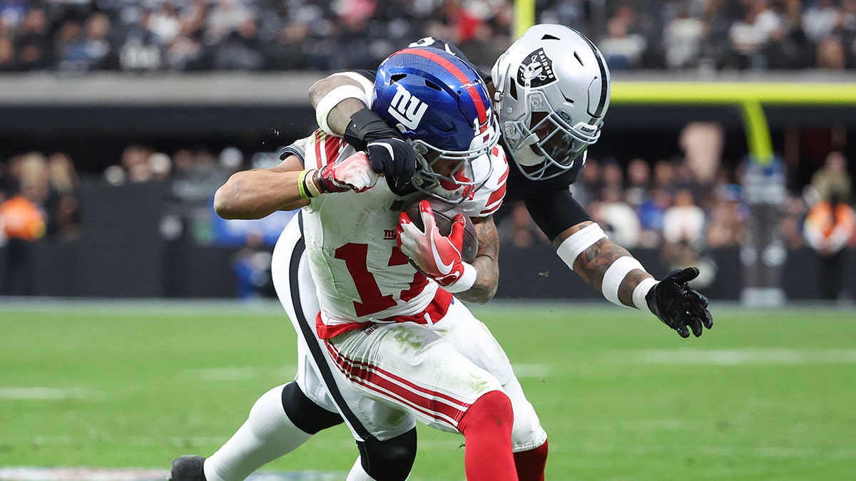 Wan'Dale Robinson tackled by Jamal Adams