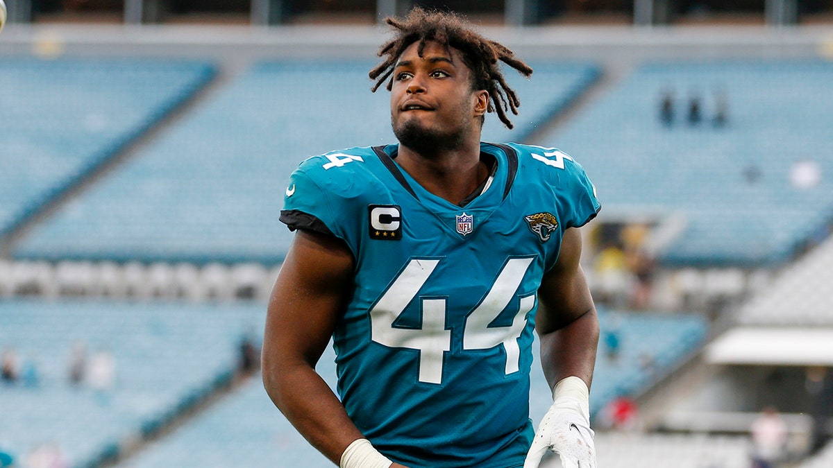 Myles Jack runs on field