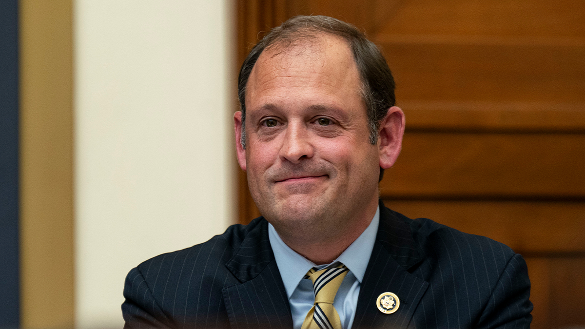 Rep. Andy Barr smiles during a House hearing