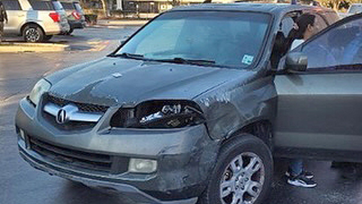Damaged car after woman runs into ICE vehicle