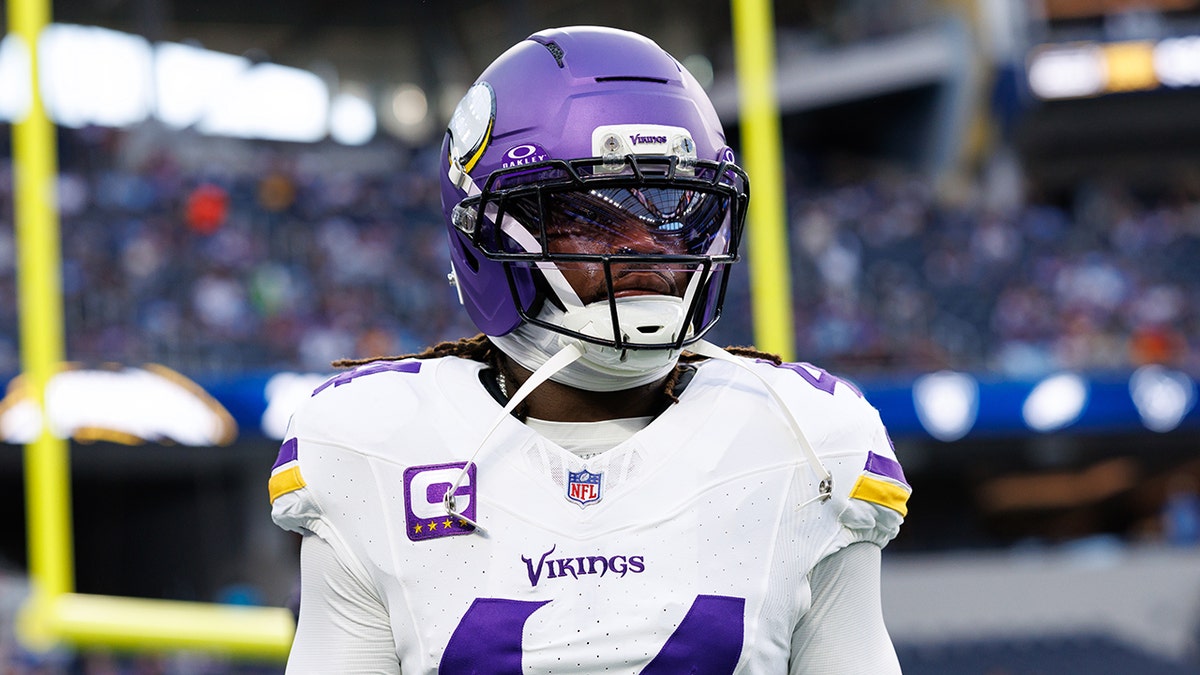 Josh Metellus looks on field