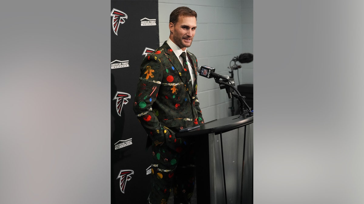 Kirk Cousins talks to reporters