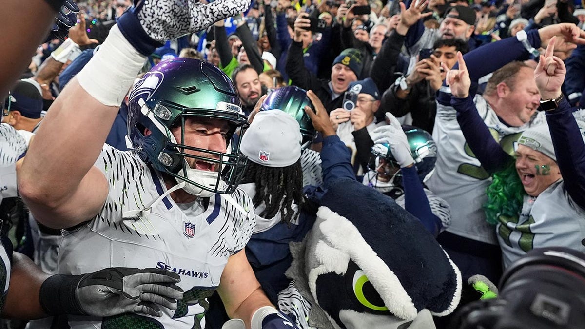 Seahawks players celebrate a win