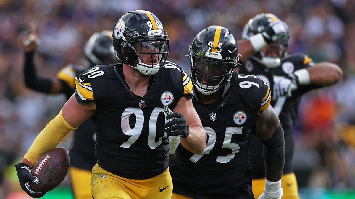 TJ Watt celebrates with the football