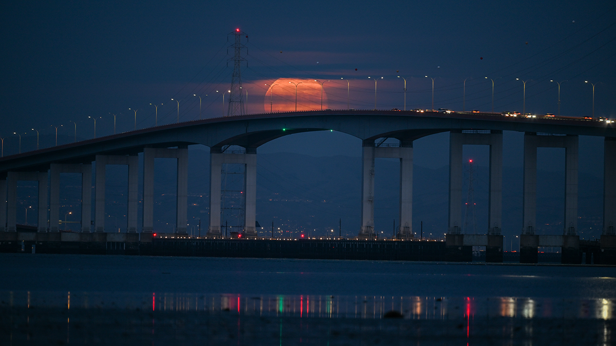 Full moon over San Mateo Bridge