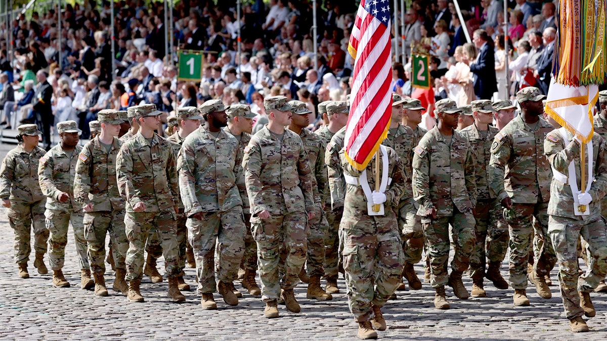 U.S. Army soldiers march in formation during Belgium’s National Day parade in Brussels.
