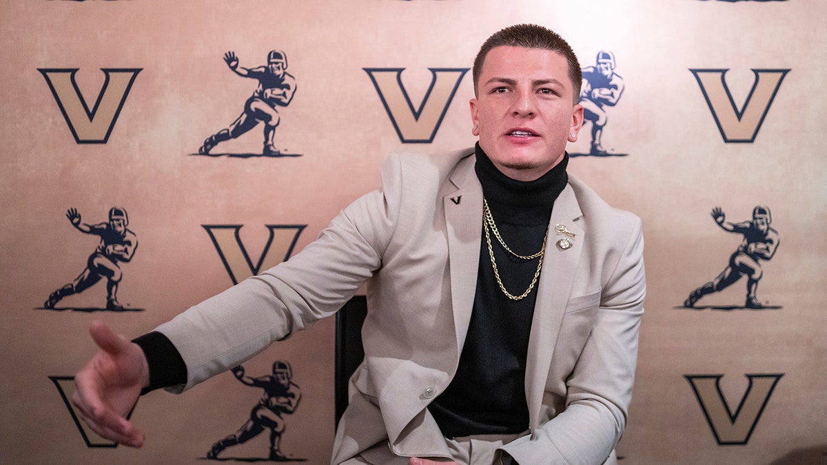 Diego Pavia talks to reporters at the Heisman ceremony