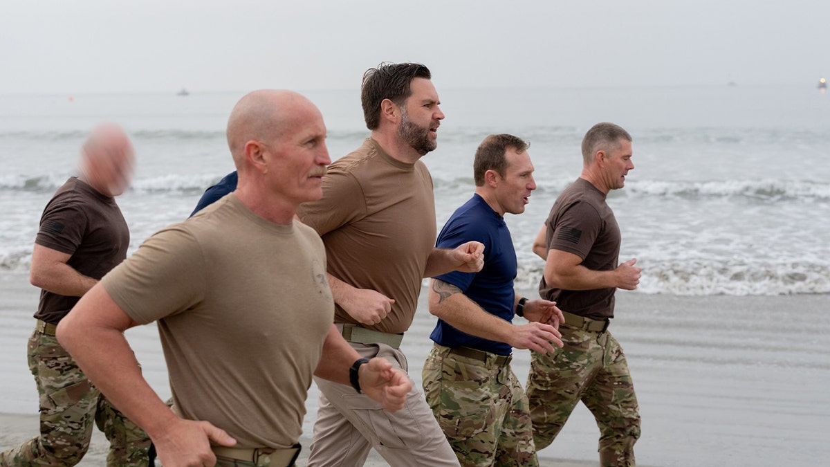 JD Vance runs on Coronado Beach.
