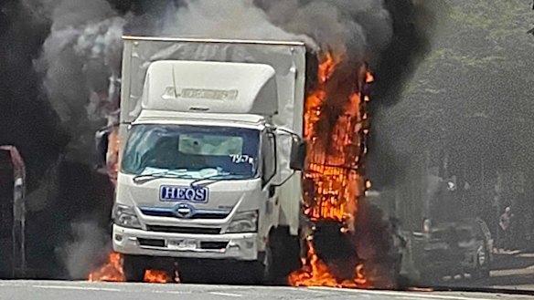 Heat from the flaming truck could be felt across the street.