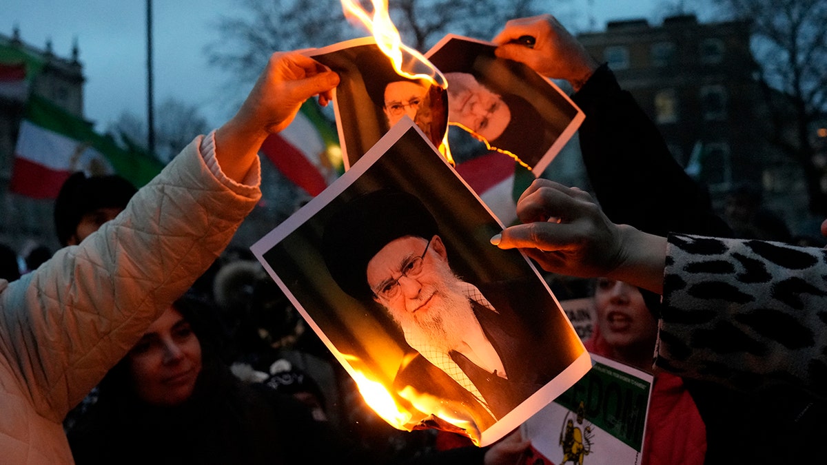 Protestors burn images of Ayatollah Ali Khamenei