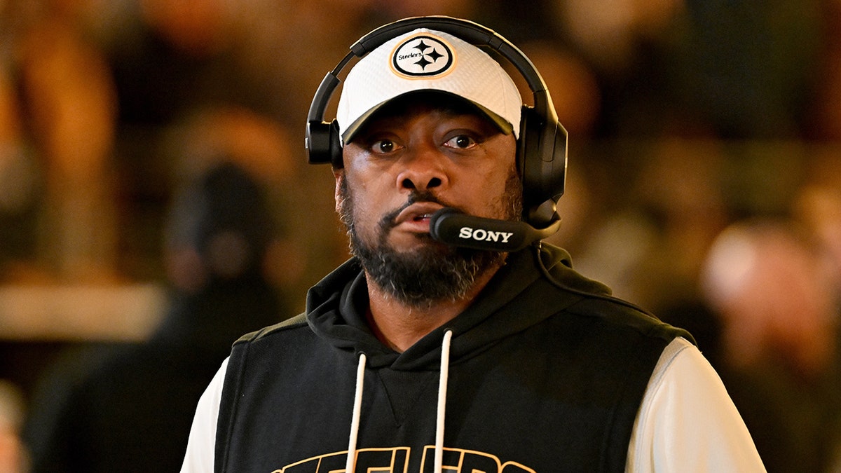 Mike Tomlin looks on