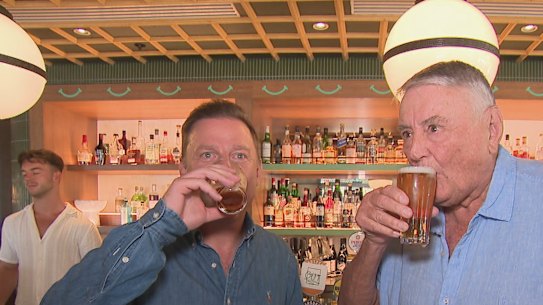 Arthur Laundy shares a beer with Ben Fordham after it was announced that Nine Entertainment sold its radio networks including 2GB and 3AW.