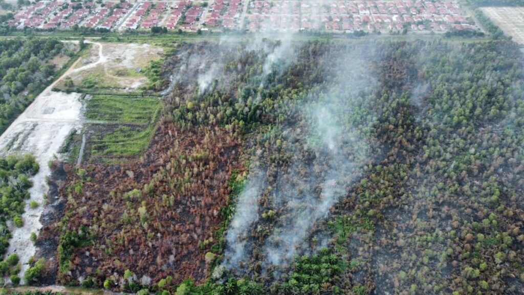 Johor conducting water bombing for partially controlled Pengerang peatland fire