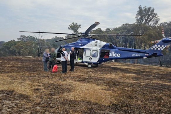 Air Wing officers speak to the residents who were evacuated due to the massive fire in north-central Victoria.