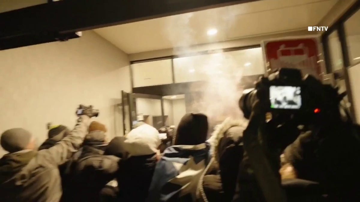 Anti-ICE protesters were seen attempting to enter a Minneapolis hotel