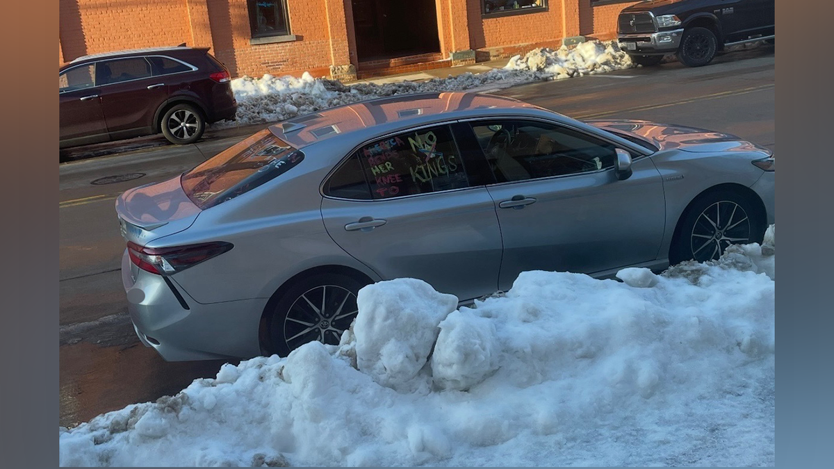 Messages including "NO KINGS" were written on a car parked outside Rep. Derrick Van Orden's office.