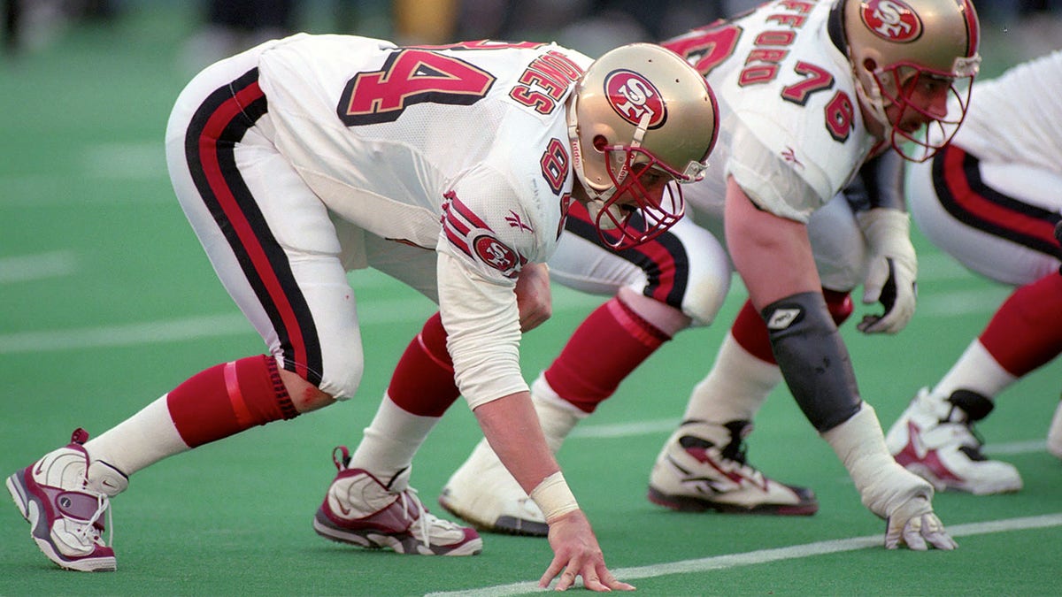 Brent Jones lines up during a game