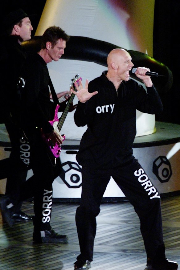 Time to say sorry: Midnight Oil making a global statement at the closing ceremony of the 2000 Sydney Olympics.