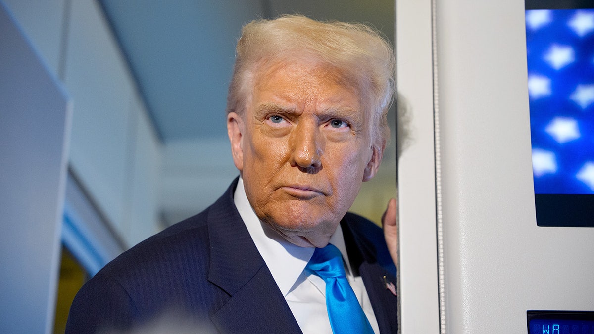 Trump speaks with reporters from Air Force One