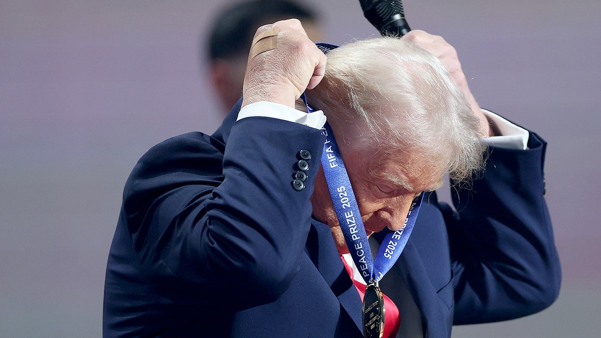 Donald Trump puts on medal