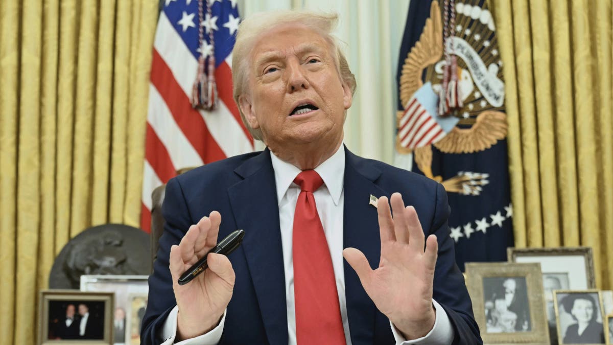 President Donald Trump speaks to reporters before signing an executive order in the Oval Office of the White House in Washington, Monday, March 31, 2025. 