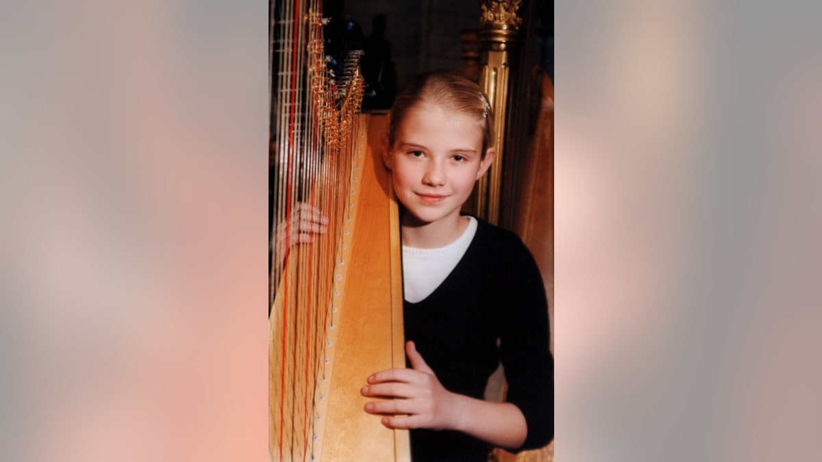 Elizabeth Smart with her harp.