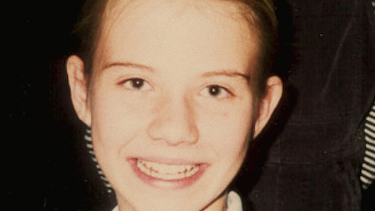 A close-up of Elizabeth Smart's face smiling.