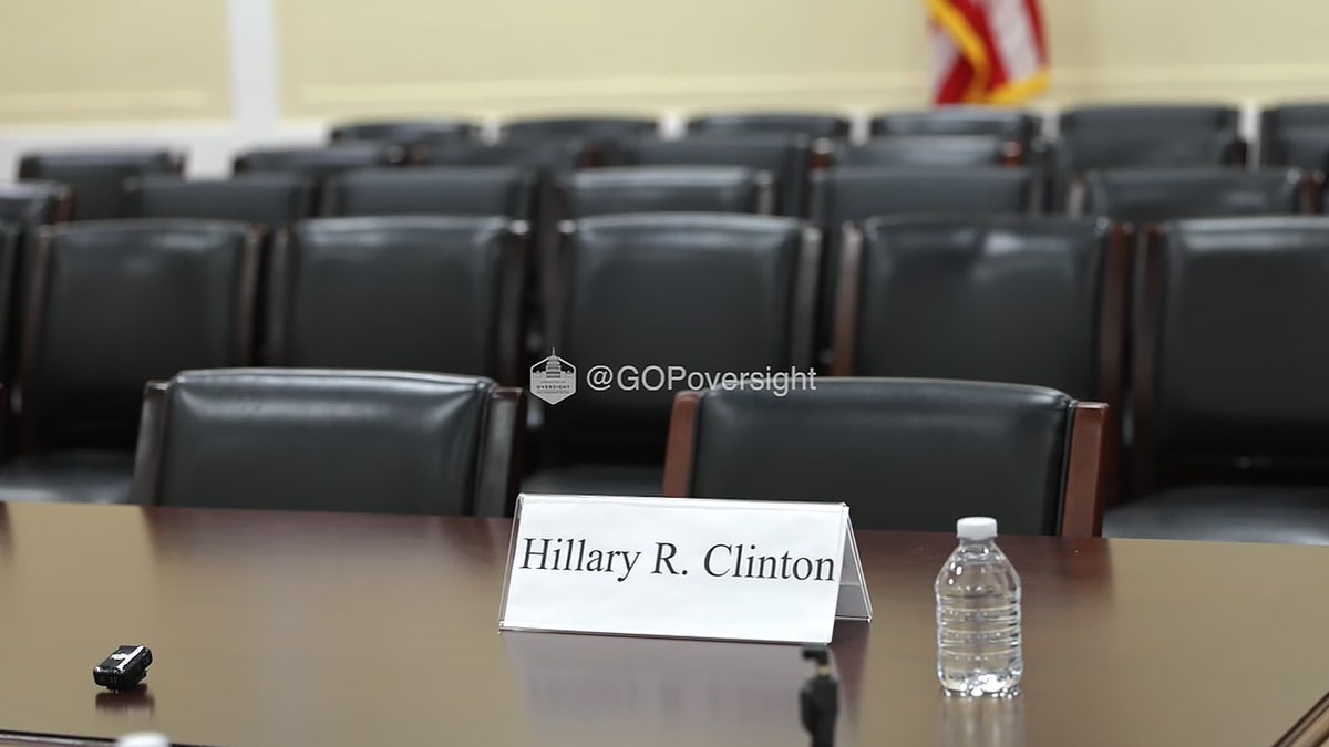An empty chair with a name card for Hillary Clinton