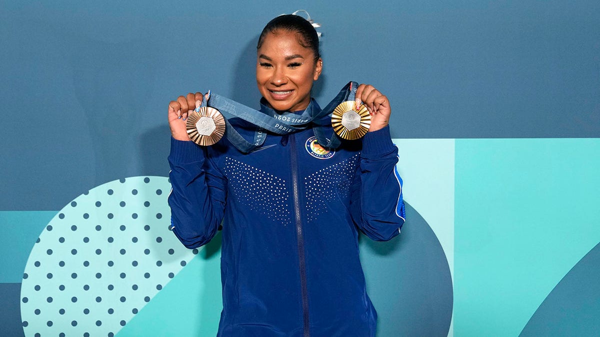 Jordan Chiles poses with medals