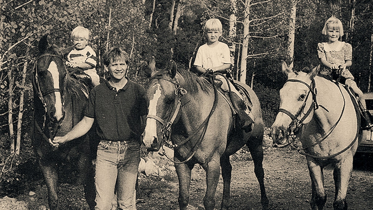 A black and white childhood photo of Elizabeth Smart.