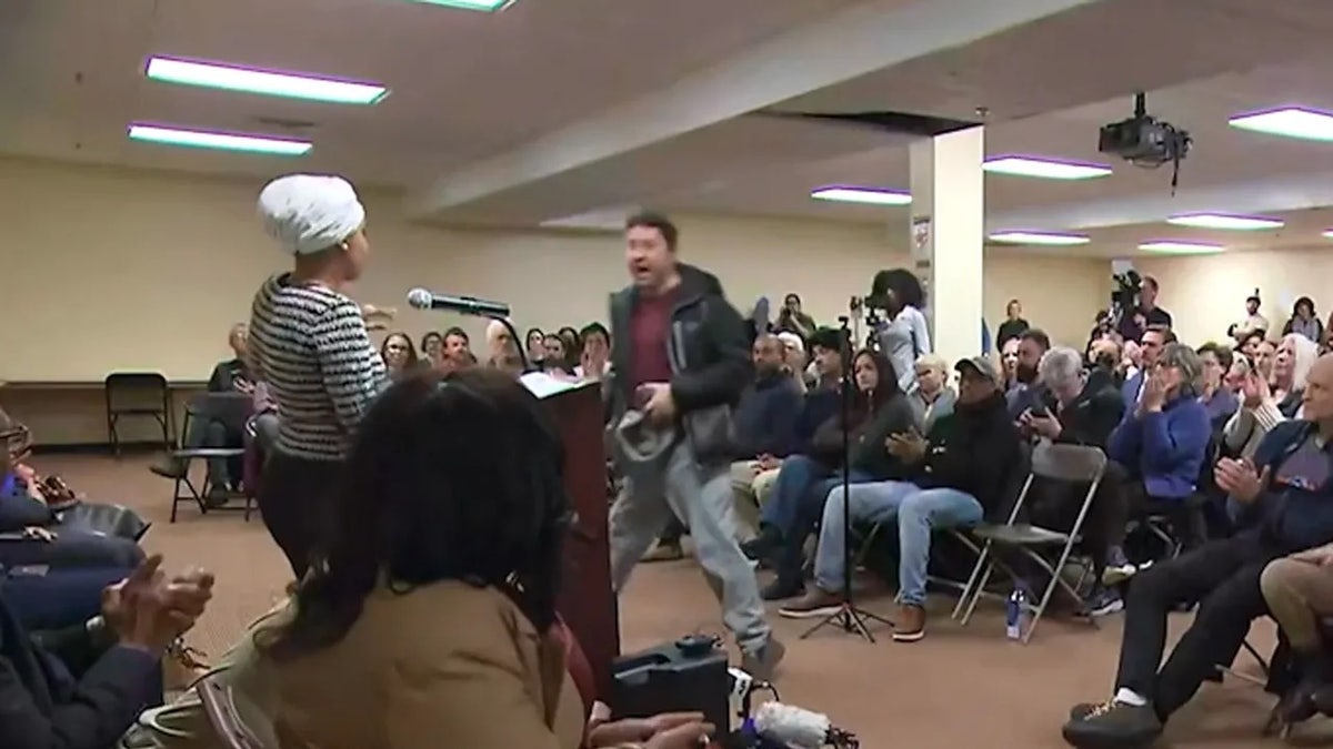 The man is seen attacking Ilhan Omar.