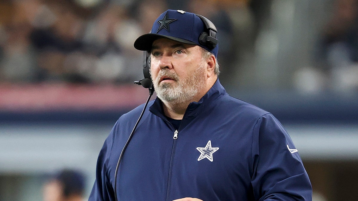 Mike McCarthy looks on