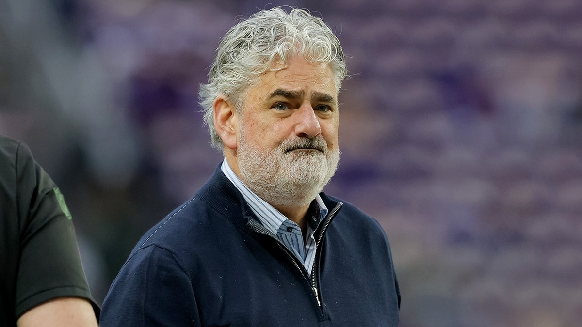 Paul Allen looks on pregame