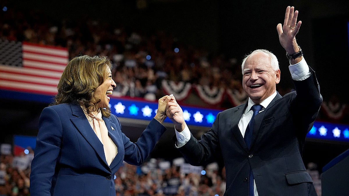 Tim Walz alongside Kamala Harris