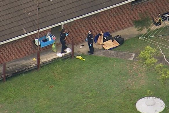 Police at the suspected ‘stronghold’ on Friday morning.