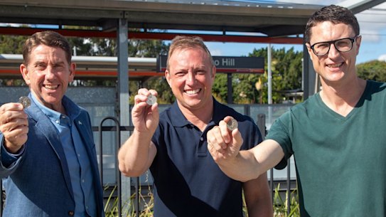 Treasurer Cameron Dick, Premier Steven Miles and Transport Minister Bart Mellish announce the six-month 50-cent public transport fares, beginning in August.