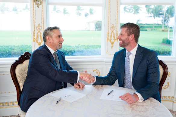 David Young signs an agreement with Eric Trump, reportedly in Florida earlier this month. 