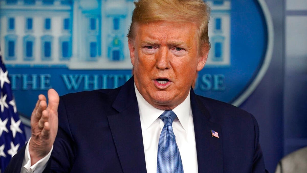 President Donald Trump speaks during a press briefing wearing a suit and tie in the James Brady Press room