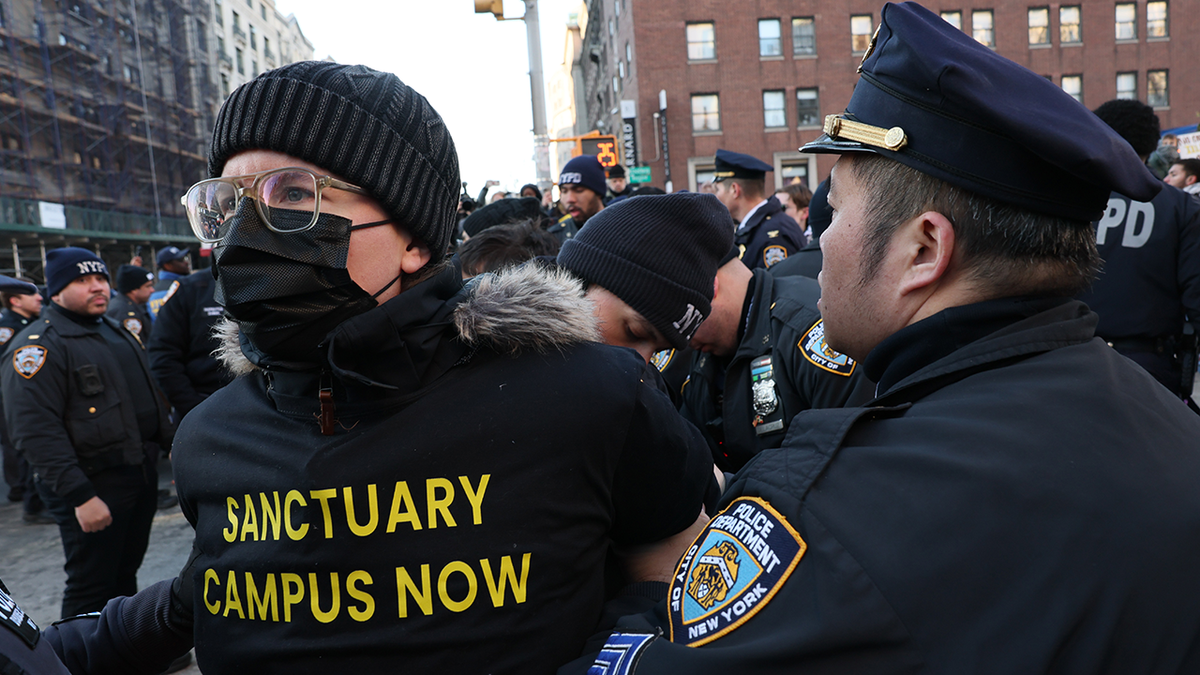 NYPD officers arrest protestors