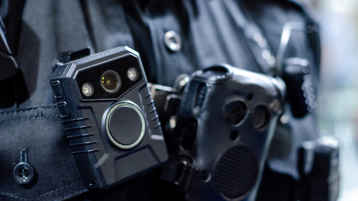 Close up body camera on police officer's chest.